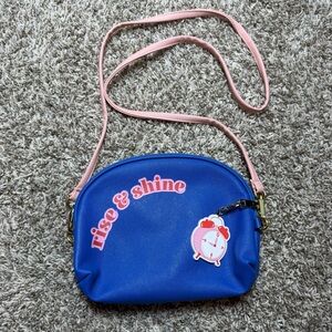 Sudio DIY Rise & Shine, Bed by 9 PM Blue Crossbody Bag with Pink Strap